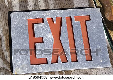 Old exit sign lying on wood. View Large Photo Image Stock Photo - Old exit sign lying on wood.. Fotosearch