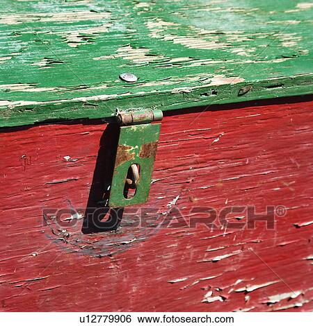Stock Photograph - Old red and green weathered wooden storage container.. Fotosearch