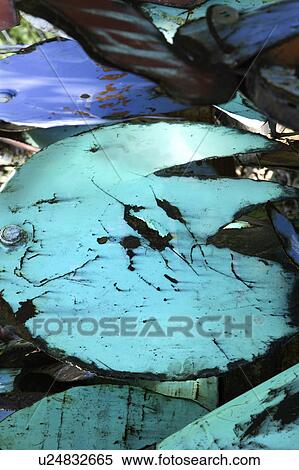 Stock Photography - Old rusty green and blue junk metal.. Fotosearch