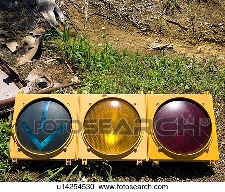 Stock Image - Old traffic light on ground. Fotosearch