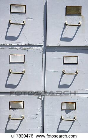 Stock Photograph - Old weathered grey cabinet outdoors.. Fotosearch