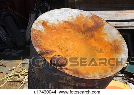 Old weathered oil barrel with rusty top. View Large Photo Image Picture - Old weathered oil barrel with rusty top.. Fotosearch
