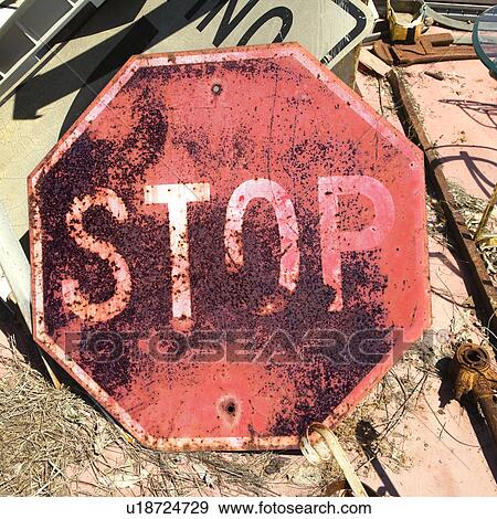 Rusty old stop sign on ground. View Large Photo Image Stock Photo - Rusty old stop sign on ground.. Fotosearch