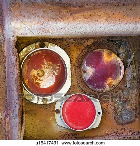 Stock Image - Rusty taillight on back of old truck.. Fotosearch