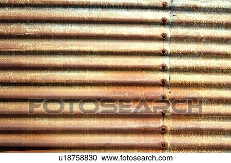 Stock Image - Side of building with old rusted corrugated metal.. Fotosearch