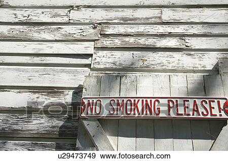 Sign on old white peeling building reading 'No smoking please! '. View Large Photo Image Stock Photo - Sign on old white peeling building reading 'No smoking please! '.. Fotosearch