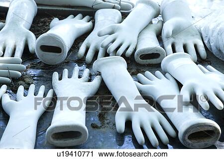 Stock Image - Table full of ceramic hand figurines.. Fotosearch