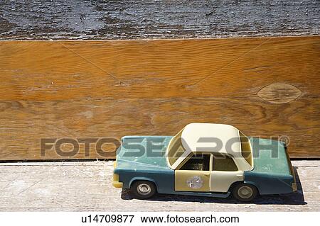 Toy police car on wooden shelf. View Large Photo Image Stock Photo - Toy police car on wooden shelf.. Fotosearch