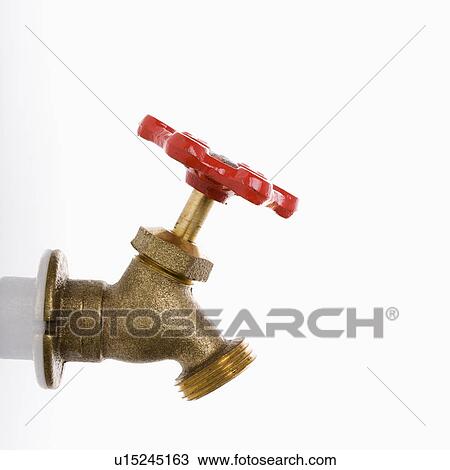 Stock Image - Brass hot water faucet. Fotosearch