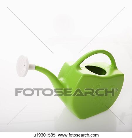 Stock Photography - Green plastic watering can. . Fotosearch