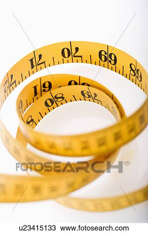 Measuring tape in a pile View Large Photo Image Stock Image - Measuring tape in a pile. Fotosearch