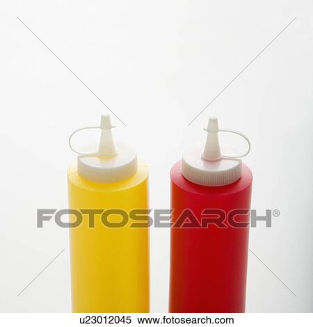 Stock Photography - Plastic ketchup and mustard containers.. Fotosearch
