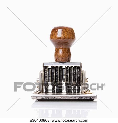 Stock Photo - Rubber stamp tool to mark dates. Fotosearch