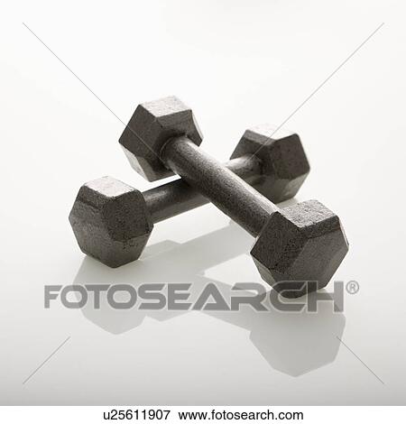 Stock Photo - Two dumbbells leaning together. Fotosearch