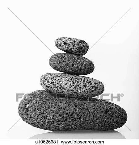 Stock Image - Cairn made of smooth stones stacked together.. Fotosearch
