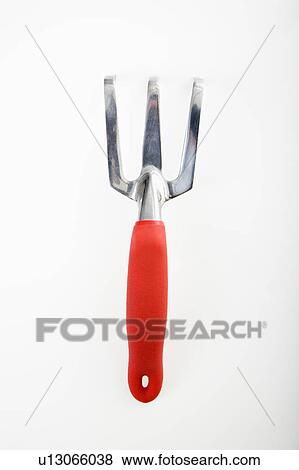 Hand held gardening fork View Large Photo Image Stock Photo - Hand held gardening fork. Fotosearch