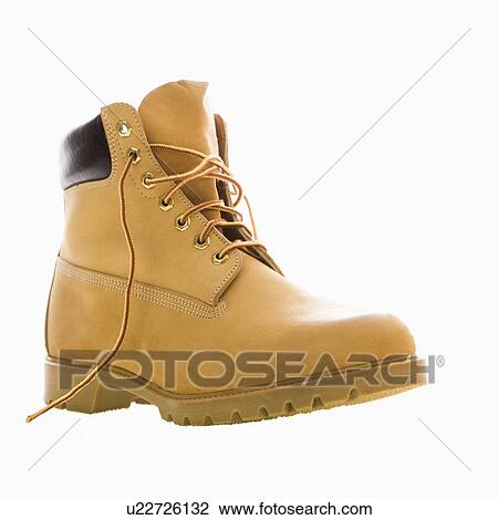 Stock Image - One tan work boot. Fotosearch