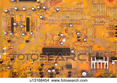 Picture - Orange circuit board detail.. Fotosearch