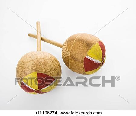 Pair of handmade Mexican maracas percussion musical instruments against white background. View Large Photo Image Picture - Pair of handmade Mexican maracas percussion musical instruments against white background.. Fotosearch