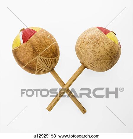 Pair of handmade Mexican maracas percussion musical instruments against white background. View Large Photo Image Stock Photo - Pair of handmade Mexican maracas percussion musical instruments against white background.. Fotosearch