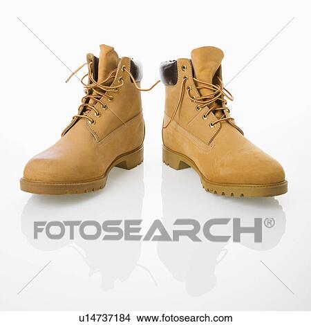 Picture - Pair of tan construction boots . Fotosearch