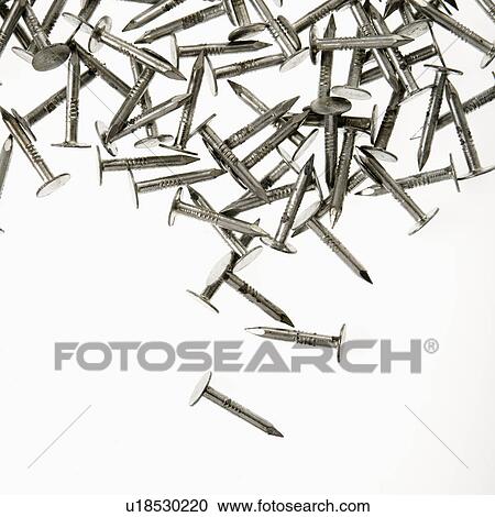 Pile of nails against white background View Large Photo Image Stock Image - Pile of nails against white background. Fotosearch