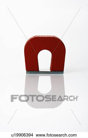 Picture - Red magnet on white background.. Fotosearch