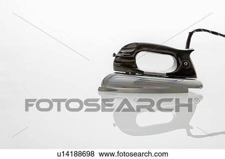 Stock Photo - Retro iron on white background.. Fotosearch