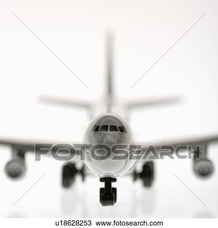 Stock Image - Selective focus of miniature model commuter jet airplane.. Fotosearch