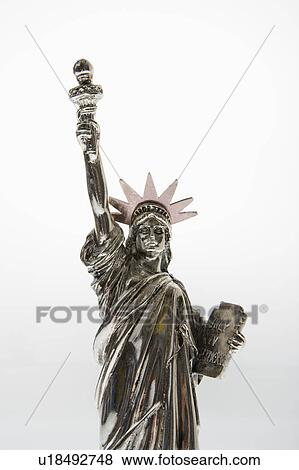 Stock Photo - Statue of Liberty reproduction on white background.. Fotosearch