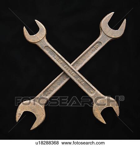 Stock Photo - Two crossed crescent wrenches. Fotosearch