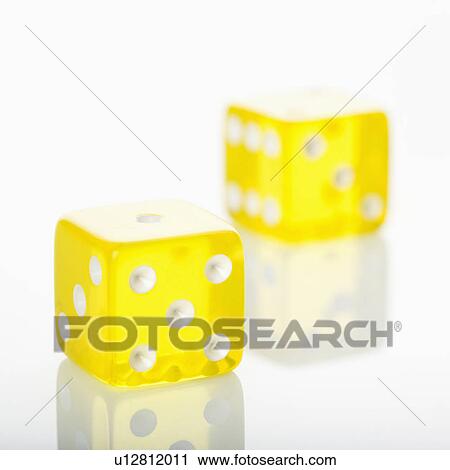 Stock Image - Two yellow dice. . Fotosearch