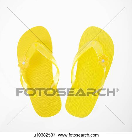 Stock Photo - Yellow plastic thong sandals.. Fotosearch