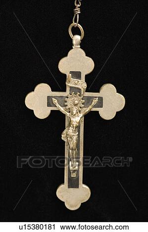 Close up of crucifix pendant against black background. View Large Photo Image Stock Image - Close up of crucifix pendant against black background.. Fotosearch