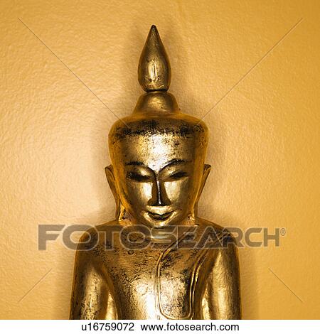 Golden wooden Buddha statue from Burma against yellow wall. View Large Photo Image Stock Image - Golden wooden Buddha statue from Burma against yellow wall.. Fotosearch