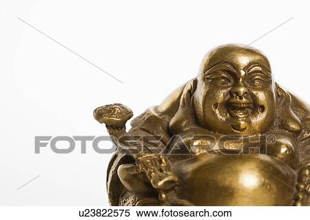 Happy laughing Buddha brass figurine on white background View Large Photo Image Stock Photography - Happy laughing Buddha brass figurine on white background. Fotosearch