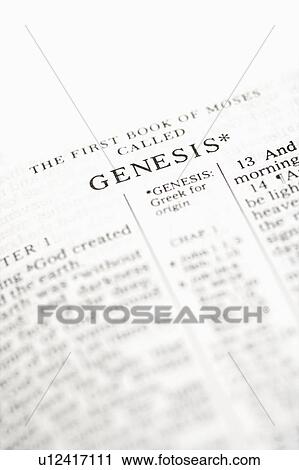 Stock Image - Selective focus of Genesis verses in open Holy Bible.. Fotosearch