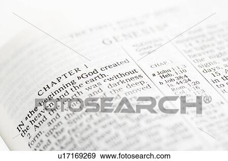 Stock Photo - Selective focus of Genesis verses in open Holy Bible.. Fotosearch
