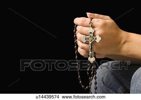 Woman holding rosary with crucifix. View Large Photo Image Picture - Woman holding rosary with crucifix.. Fotosearch