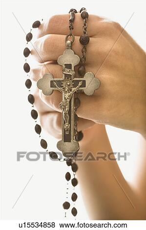 Woman's hands holding rosary with crucifix View Large Photo Image Stock Photo - Woman's hands holding rosary with crucifix. Fotosearch