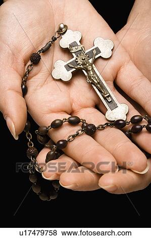 Woman's hands palm up cradling rosary with crucifix. View Large Photo Image Stock Photo - Woman's hands palm up cradling rosary with crucifix.. Fotosearch