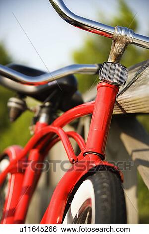 Red bike leaning against railing of boardwalk View Large Photo Image Stock Photograph - Red bike leaning against railing of boardwalk. Fotosearch