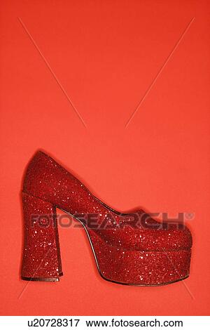 Red glitter high heel shoe against red background. View Large Photo Image Stock Photo - Red glitter high heel shoe against red background.. Fotosearch