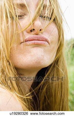 Close up portrait of blonde woman making a funny face. View Large Photo Image Stock Photograph - Close up portrait of blonde woman making a funny face.. Fotosearch