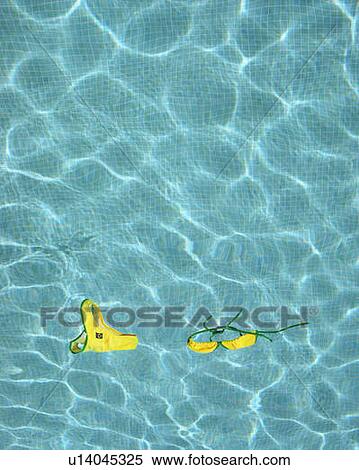 Stock Photography - Bikini floating in empty pool.. Fotosearch