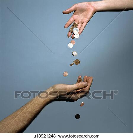 Hands dropping coins View Large Photo Image Stock Photo - Hands dropping coins. Fotosearch