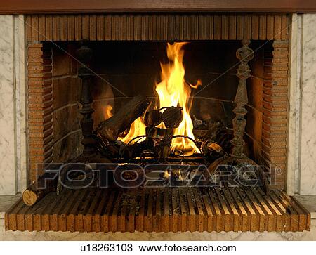Log fire burning in fireplace with red brick surround View Large Photo Image Stock Image - Log fire burning in fireplace with red brick surround. Fotosearch