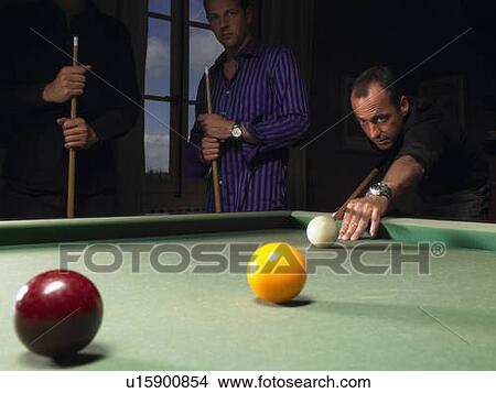 Picture - Men playing snooker. Fotosearch
