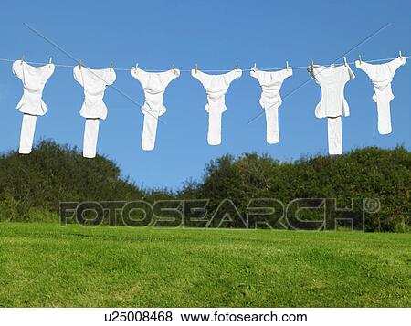 Stock Photo - Nappies hanging on washing line. Fotosearch