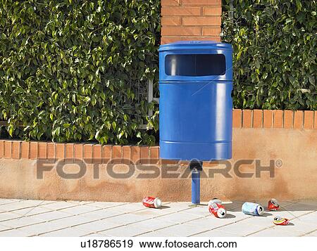 Public bin on pavement surrounded by discarded cans, Alicante, Spain, View Large Photo Image Stock Photo - Public bin on pavement surrounded by discarded cans, Alicante, Spain,. Fotosearch